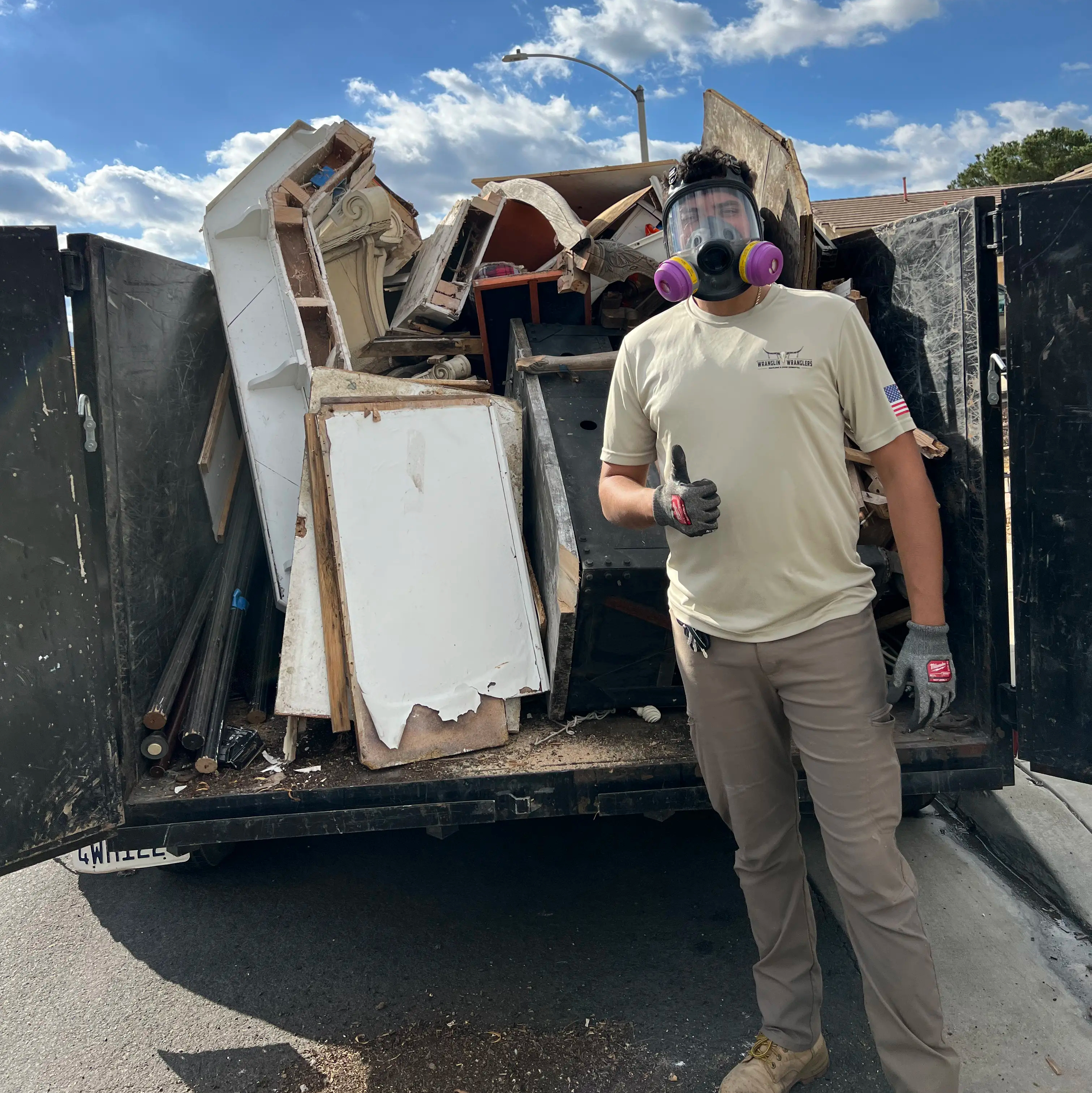 Wranglin' Wranglers crew member loading bulky junk for removal